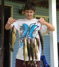 Fishing Lake Nipissing. Boy fishing on Lake Nipissing